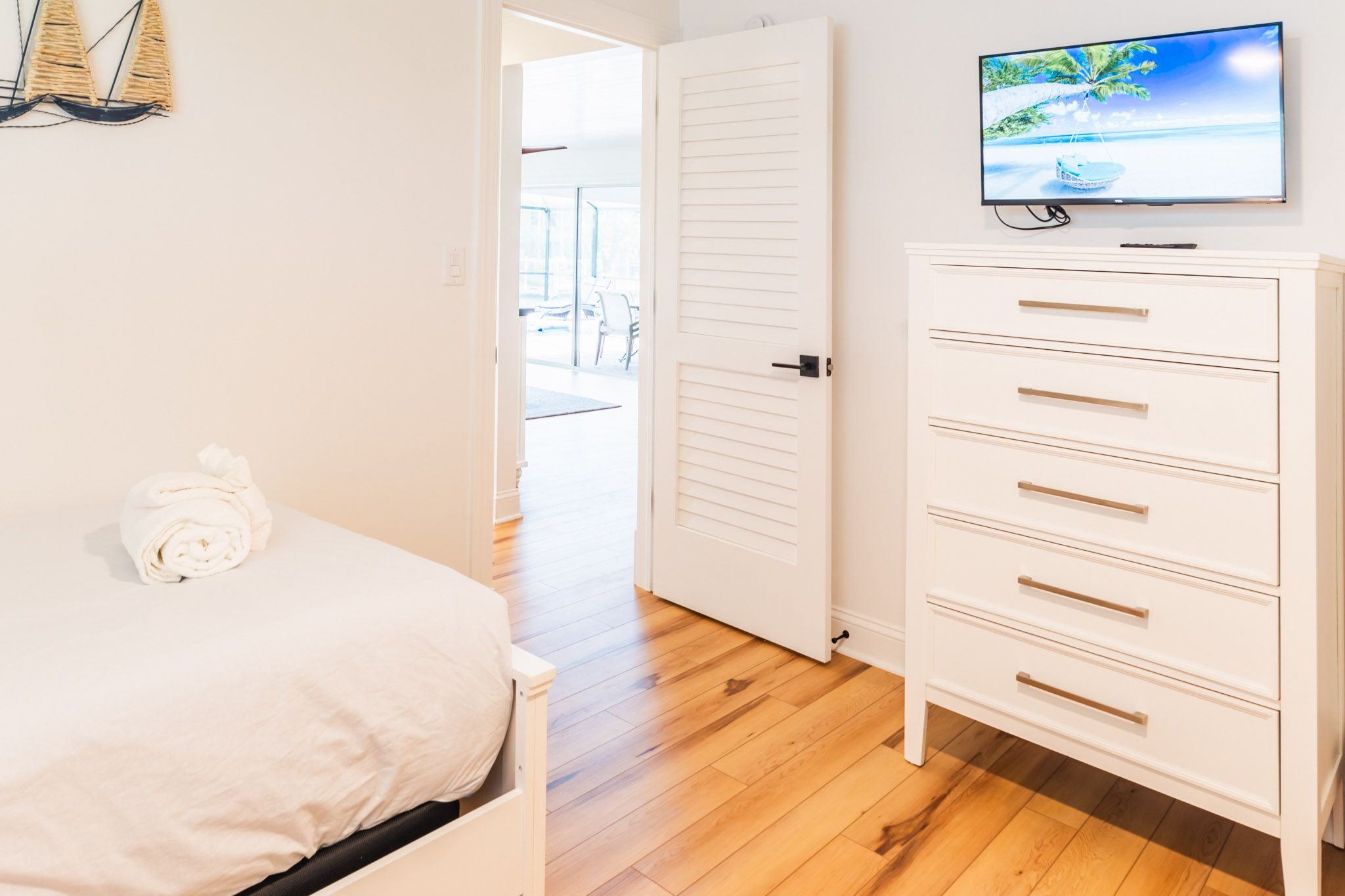 Coastal guest bedroom with clean aesthetic.