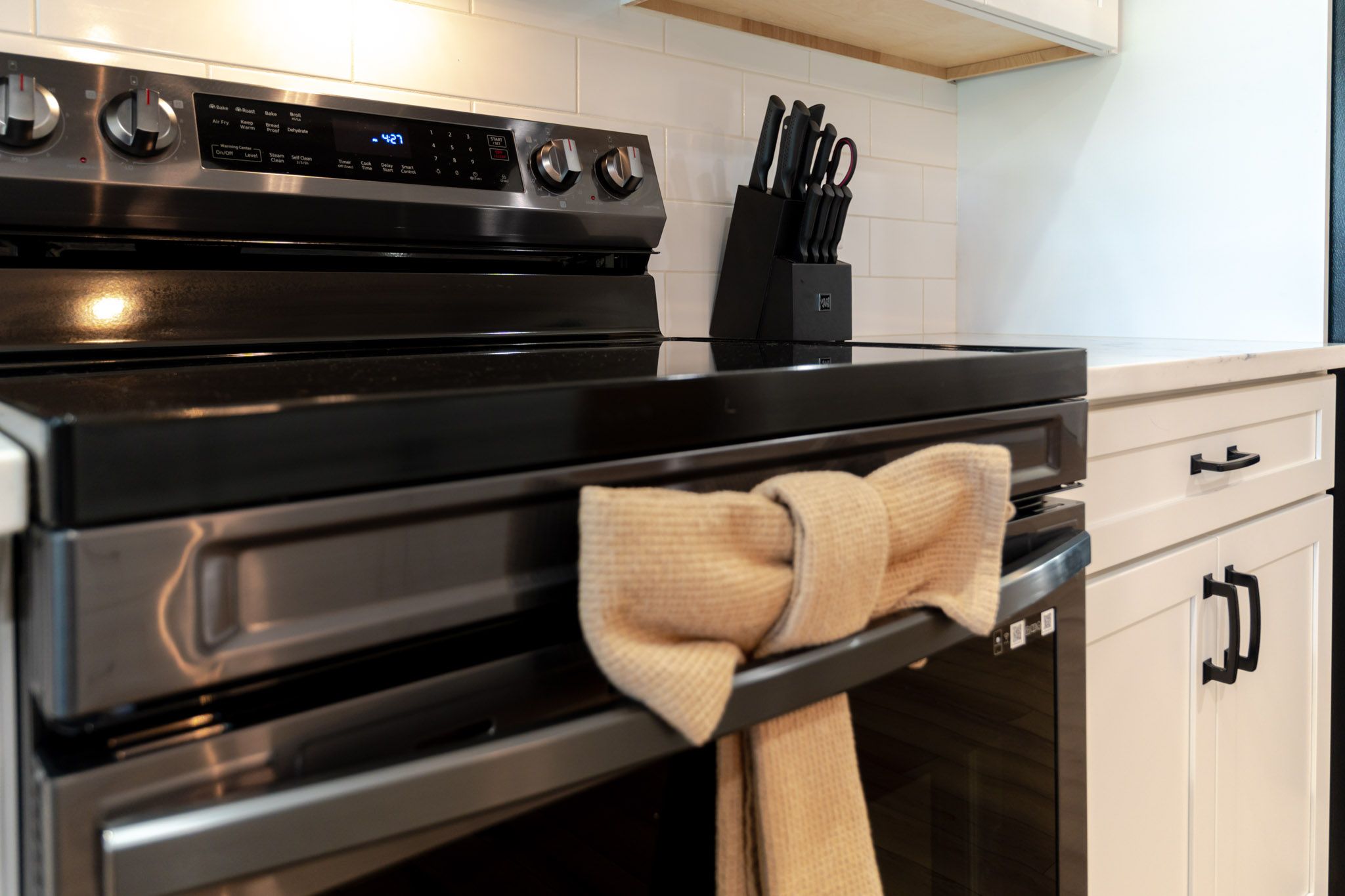 Modern kitchen with white cabinetry.