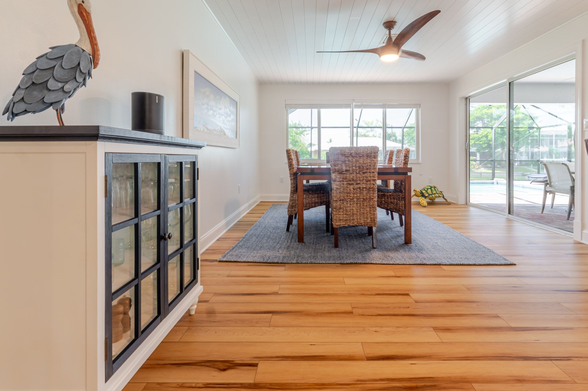 Dining and living flow with vaulted ceilings.