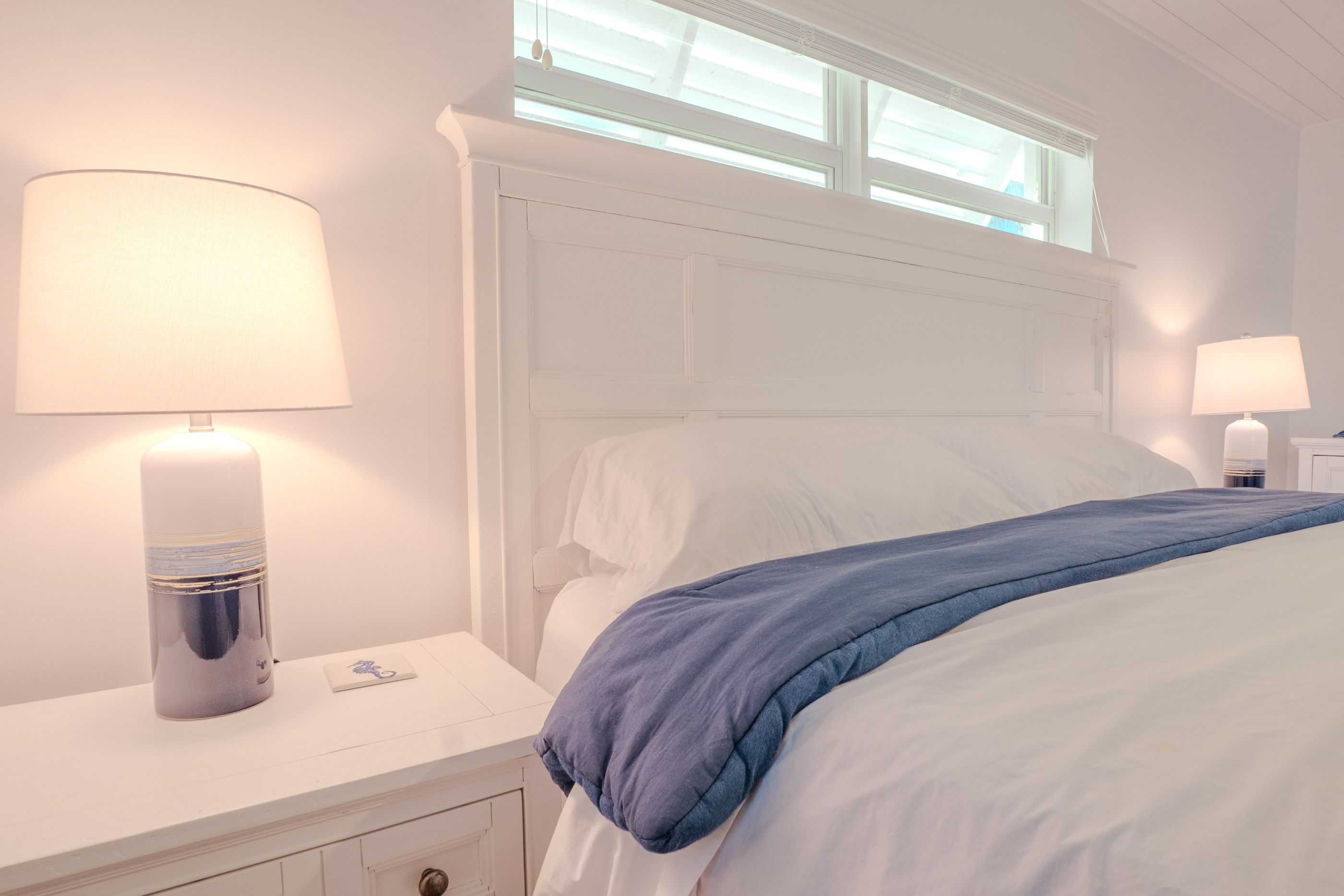 Twin bedroom with nautical decor.