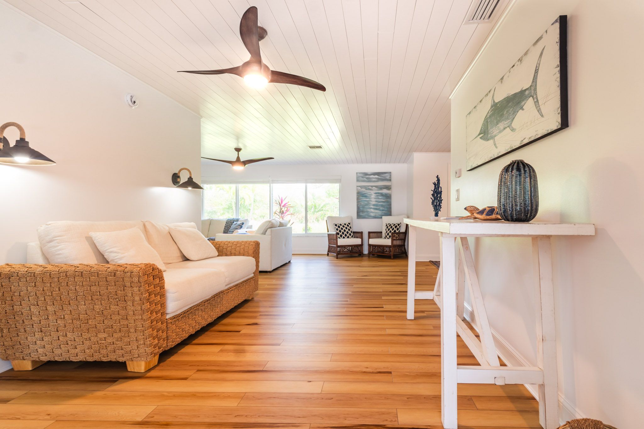 Open living room with coastal furnishings.